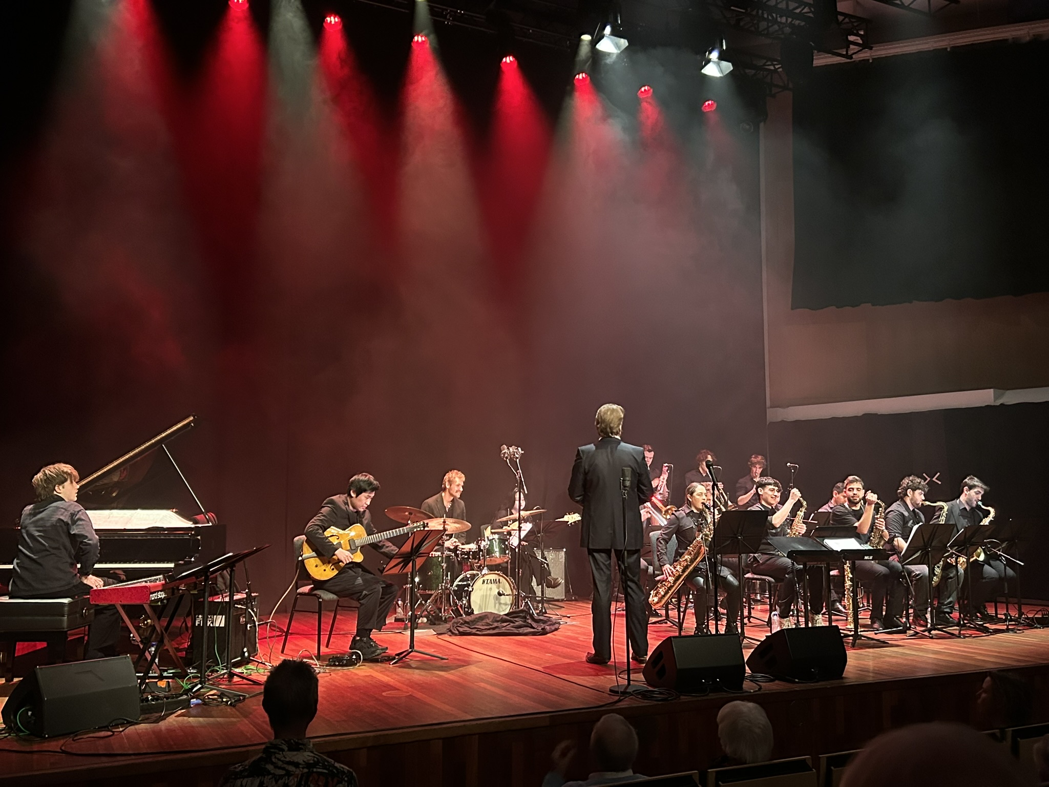 Fontys Bigband on stage with conductor facing the ensemble